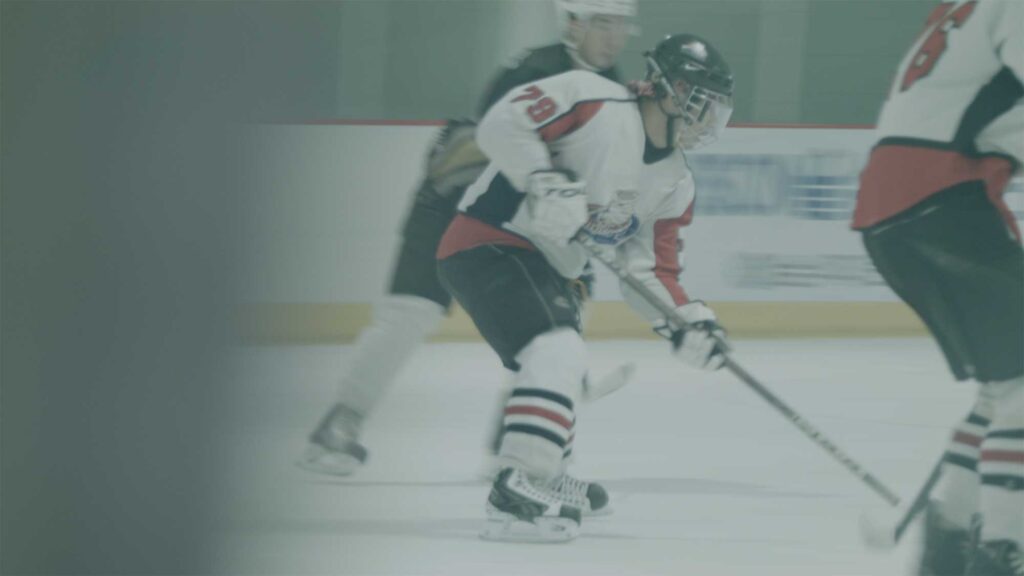 Choa, a female Korean ice hockey player, poised to take a shot on the ice during a game as the only woman on South Korea’s men’s team.