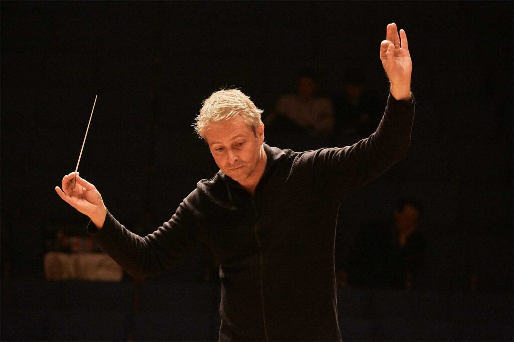 Alexander Liebreich, principal conductor of Munich Chamber Orchestra, orchestrating at a practice session in North Korea with students at Pyongyang Kim Won Gyun Conservatory