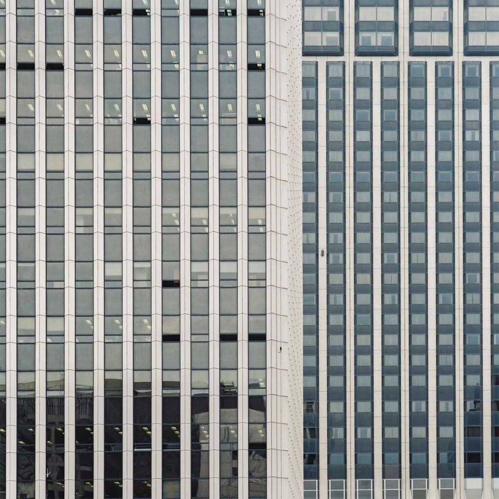 Modern architectural blend of concrete and glass façade in Seoul's bustling Gangnam district