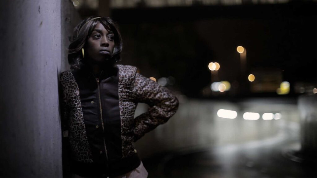 "Look Right Through" Storm Queen Music Video - Female talent stands beside a dark road in Oslo, Norway