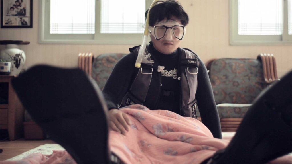 Sincity Music Video - Waking from a nightmare, the fish balloon owner finds himself in his home, still clad in his wetsuit and diving gear. As he awakens, he realizes with a start that his beloved fish is missing