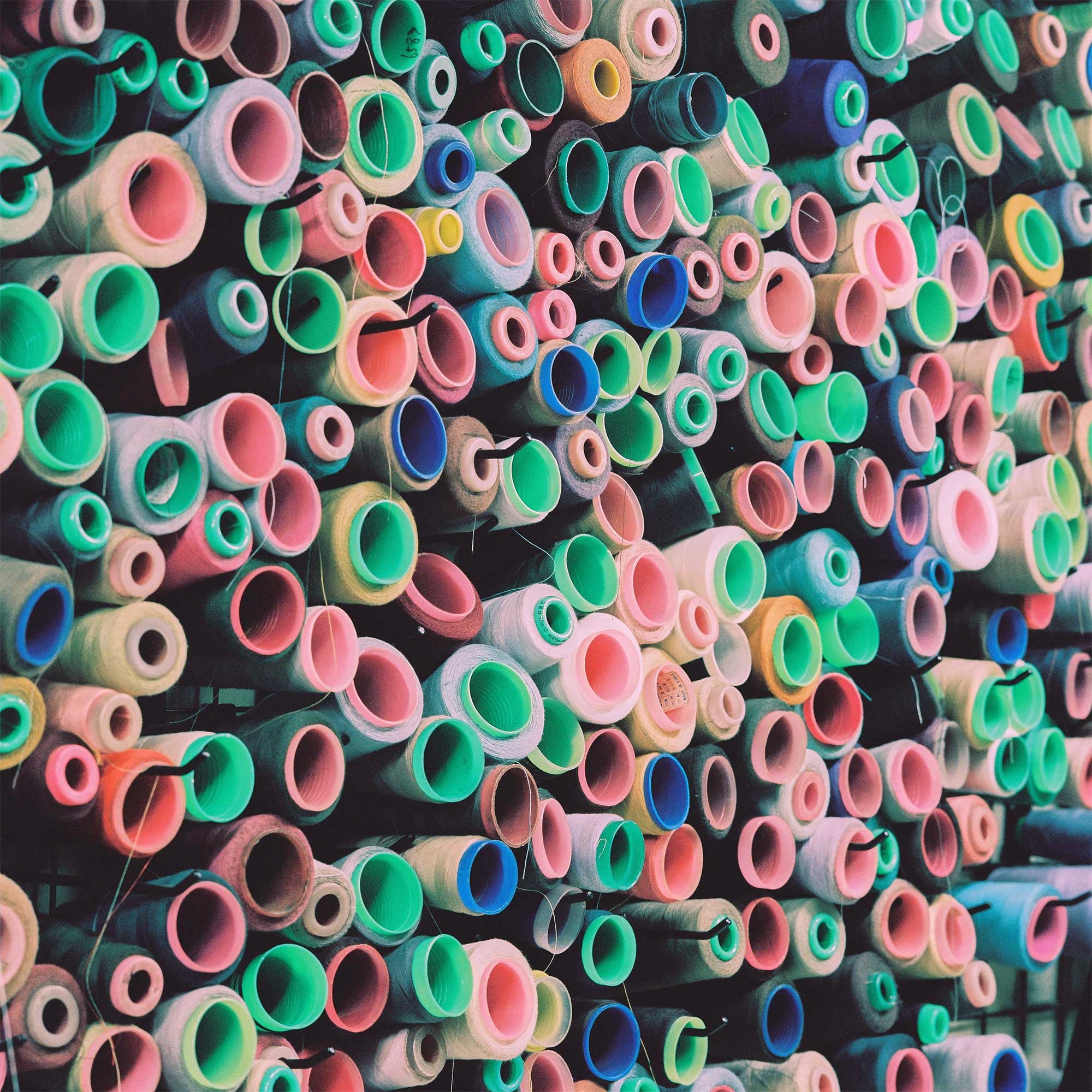 Colorful thread spools adorn the walls of a quaint tailor shop in Jongro, Seoul, Korea