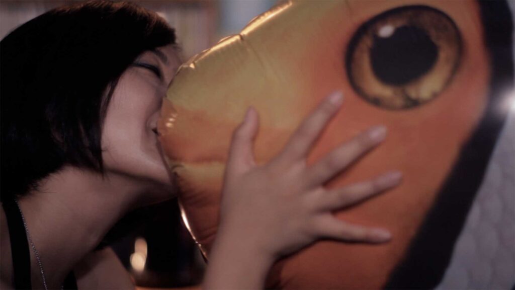 Sincity Music Video - The balloon-like fish in the bar begins kissing a female stranger, leading to trouble
