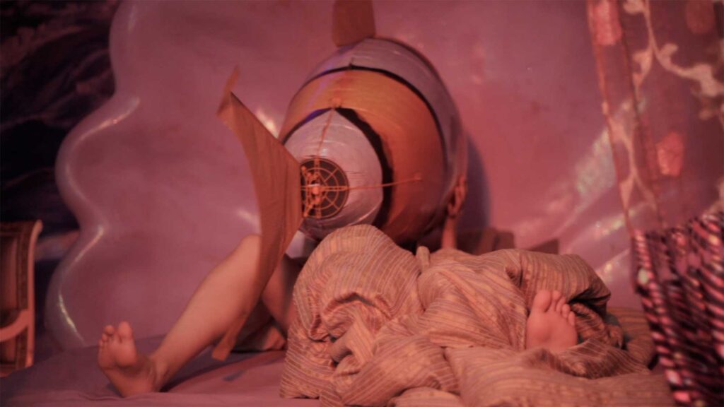 Sincity Music Video - The balloon-like fish ends up in bed with the female stranger in a cheesy motel in Seoul, South Korea.