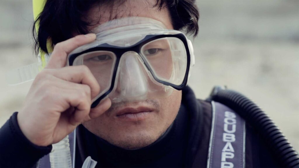 Sincity Music Video - The owner of the balloon-like fish sits on a beach on the East Coast of South Korea, lifting his goggles, he discovers the fish washing up on the shoreline.