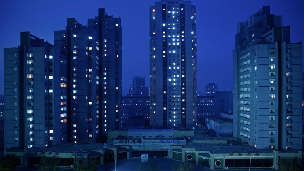 Apartment building complex illuminated at night in Pyongyang, North Korea
