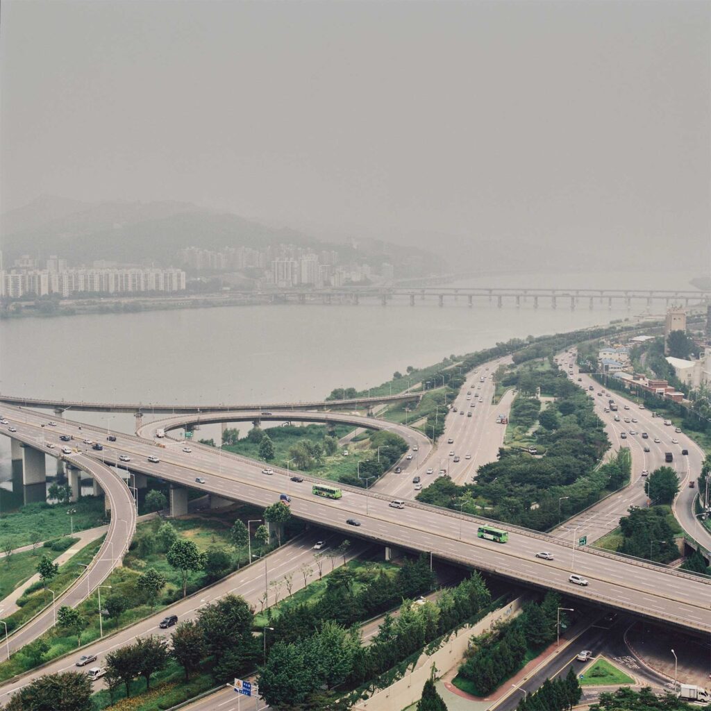 Highway flyovers connecting bridges over the Han River in Seoul, South Korea, creating a bustling network of transportation infrastructure