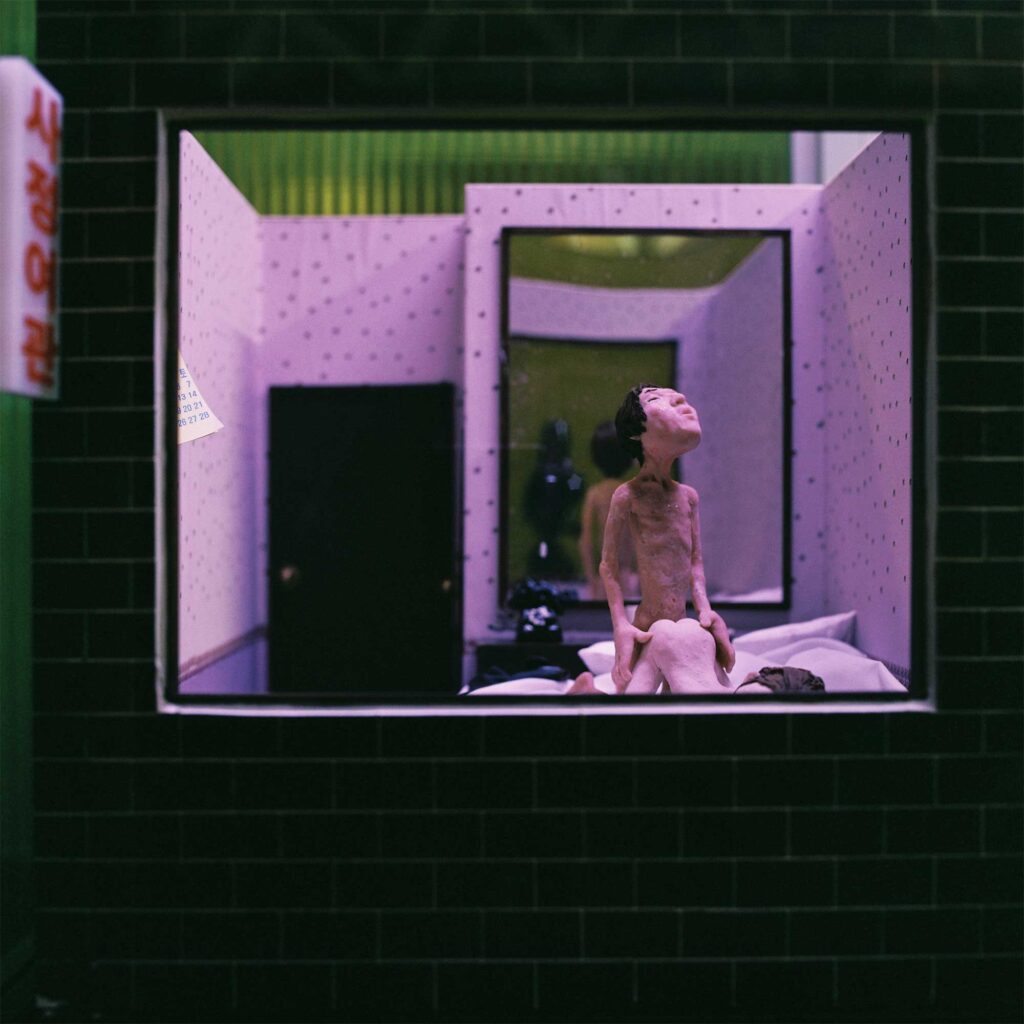 Miniature Sculpture of man penetrating woman from behind in motel in Loveland Sculpture Park on Jejudo Island, South-Korea