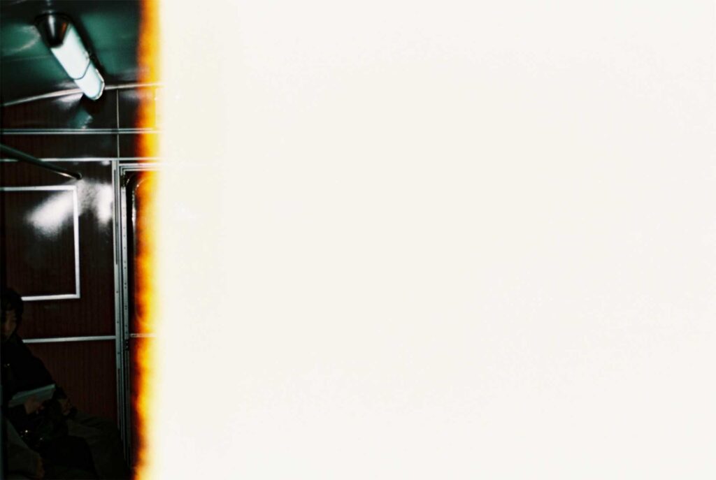 The end of a 35mm film strip, exposed to light, captured on a subway train in Pyongyang, North Korea