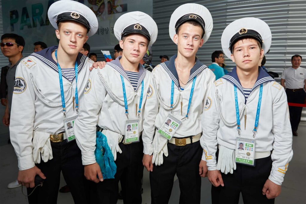 Russia’s National Day event at the World Exhibition in Yeosu, South Korea, featuring Russian marine soldiers attending and posing for a photograph.