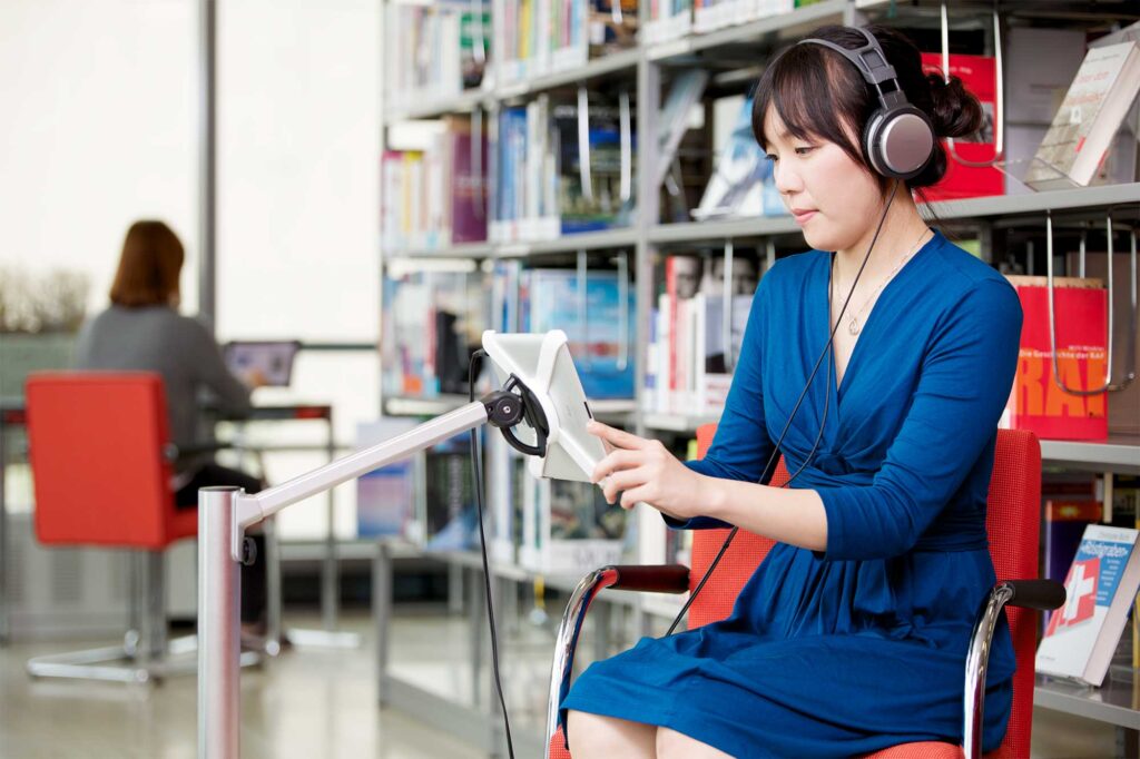A Korean student studies using the online media database in the library to improve their German language skills at the Goethe Institut in Seoul.
