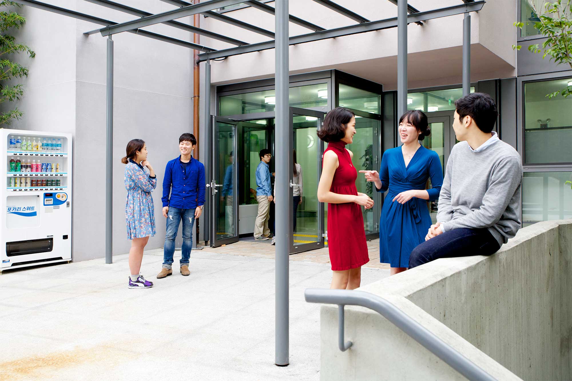 Korean students outside the Goethe Institut in Seoul enjoy their break-time between German language classes.