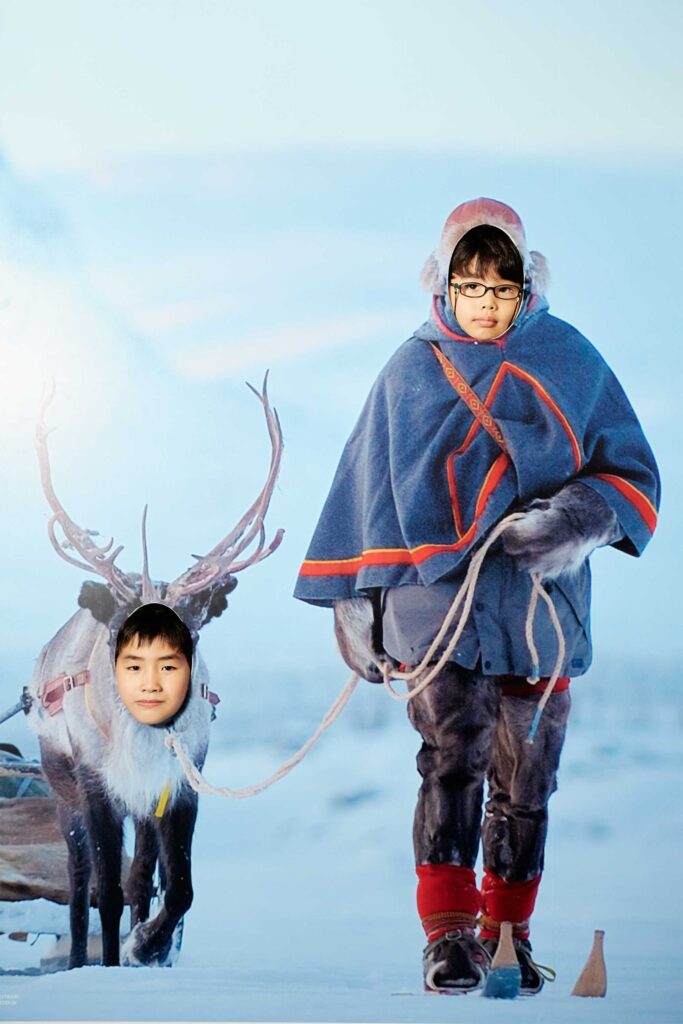 Sweden’s National Day event at the World Exhibition in Yeosu, South Korea, showcasing a photo wall with visitors cross-country skiing in a snowy Swedish landscape alongside a majestic elk