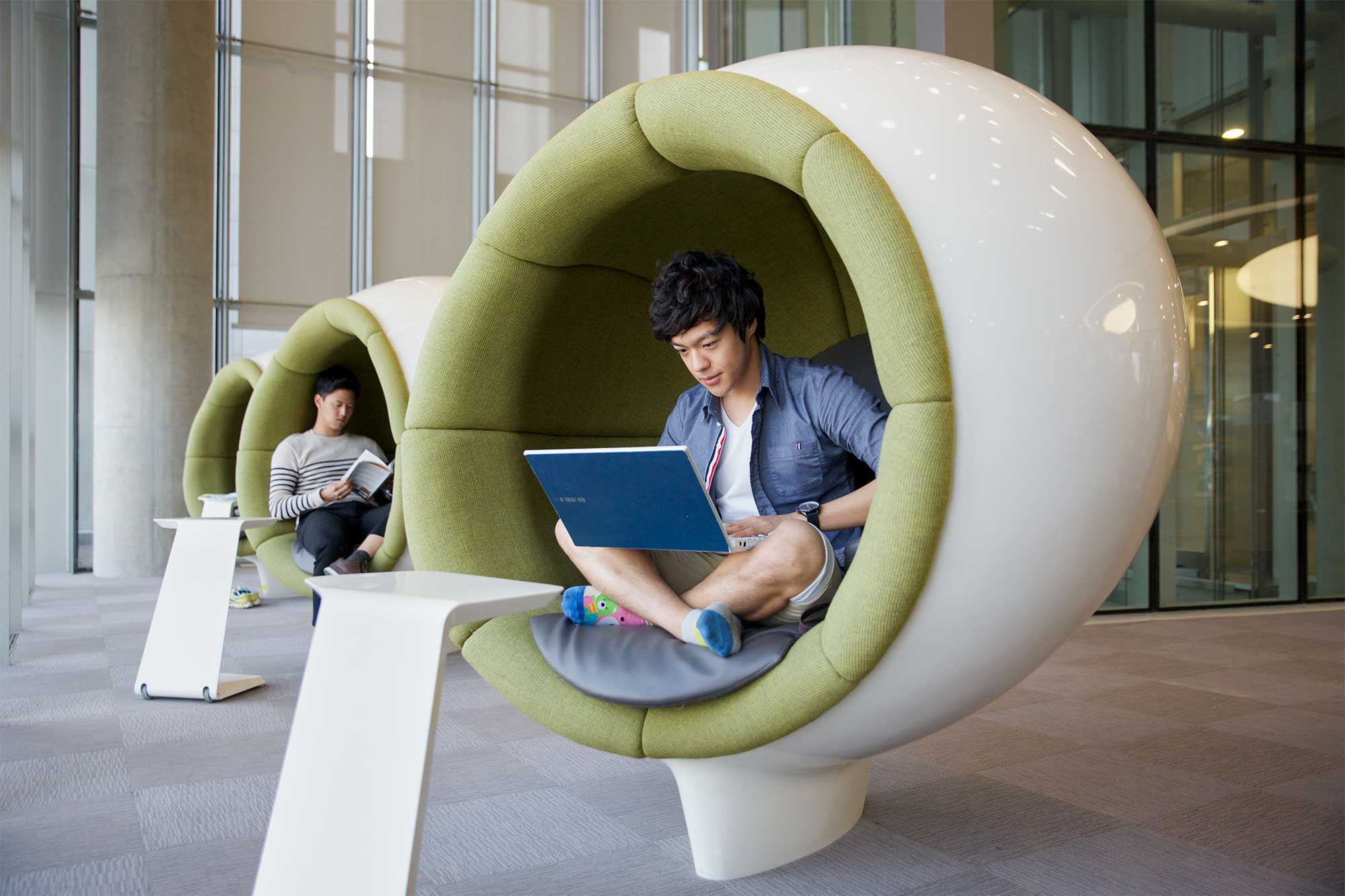 Two Underwood International College students find a quiet moment in the pods near the library at Songdo campus, Yonsei University, Seoul, South Korea.