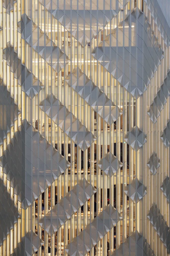 The intricately ornamented facade of The Burberry Flagship Store glows brightly, highlighting its stunning architecture at night in Seoul, South Korea.