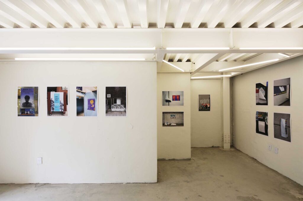 A section of exhibition space adorned with posters for the poster exhibition in Seoul, South Korea, by Graphic Magazine as part of Propaganda Press.