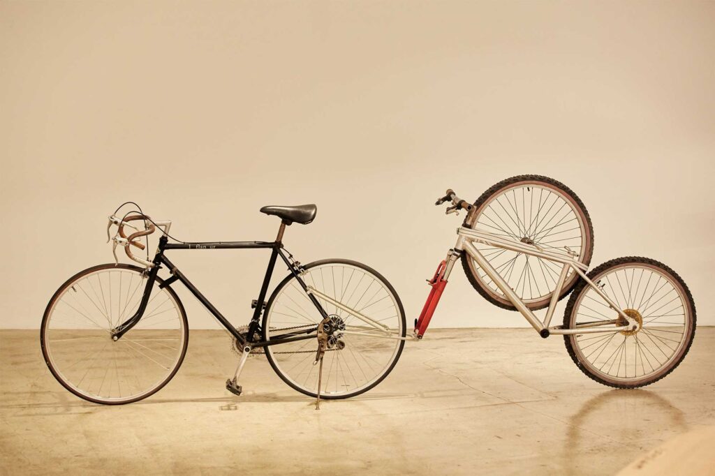 A one-wheeled bicycle frame is attached to the back of a classic road bike, forming an installation piece by Korean artist Kim Jongbum at an exhibition in Seoul, South Korea.