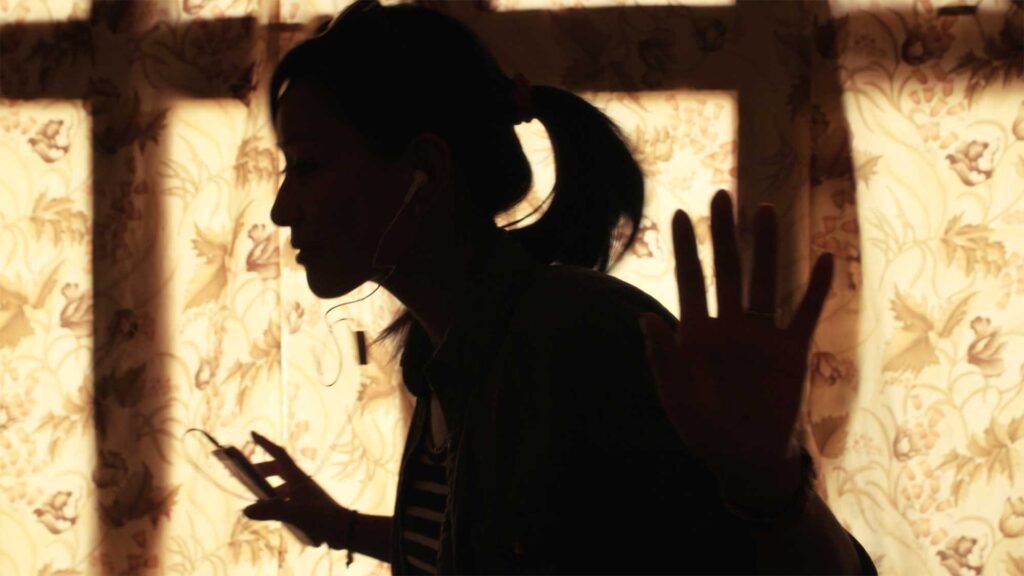 Poster Image of Samsung Ladakh campaign featuring a beautiful young woman from Leh, Ladakh, India, dances to music in her room, her silhouette outlined against a sunlit curtain.