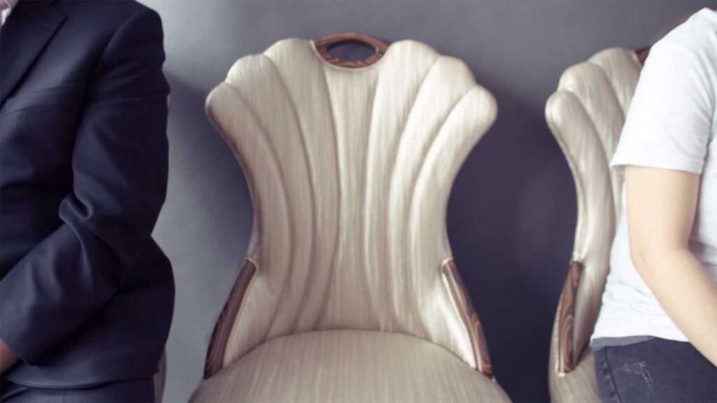 A husband and wife pose for a family portrait, leaving an empty chair for their daughter, who was among the many lives lost in the Sewol ferry disaster in South Korea.