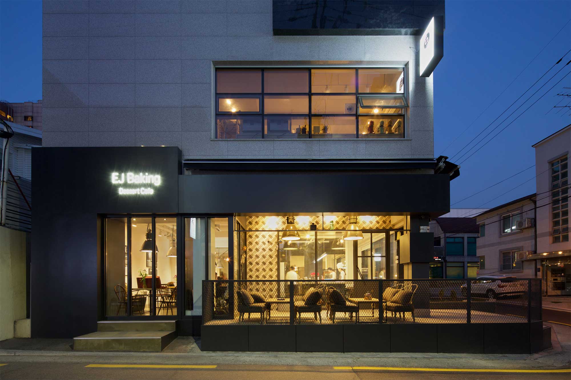 An exterior evening view of pastry chef Eun Jeong Lee's EJ Baking studio and cafe in Seoul, captured for the ELLE & VIRE PROFESSIONNEL PRINT MAGAZINE series.