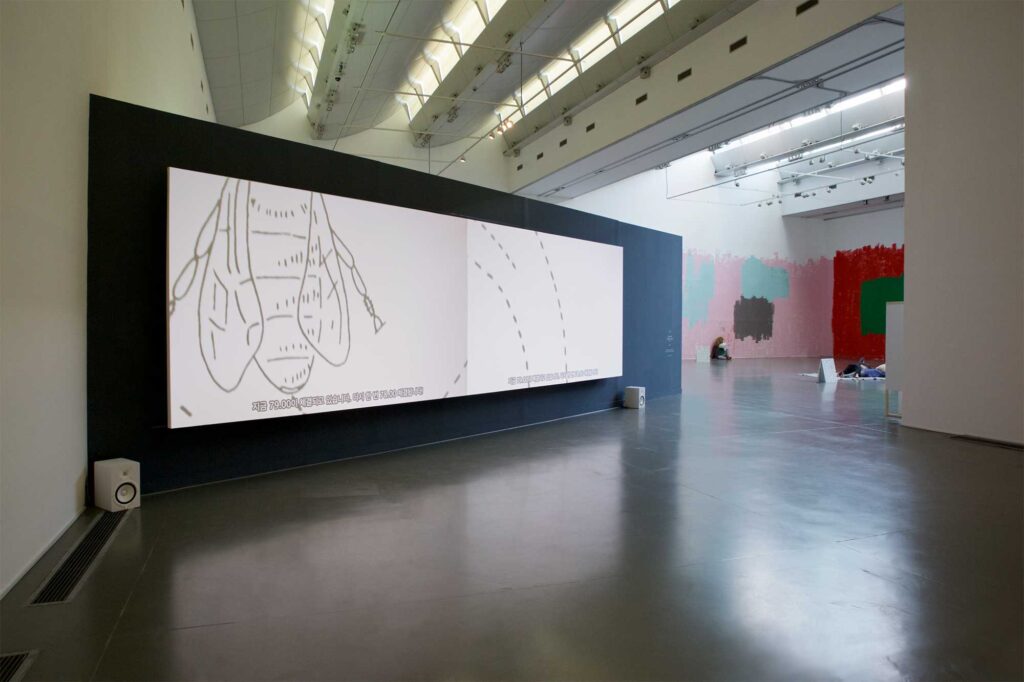 Large video projection showcasing video art exploring various paths honey bees take, part of Irony & Idealism exhibition at Gyeonggi Museum of Modern Art, South Korea.