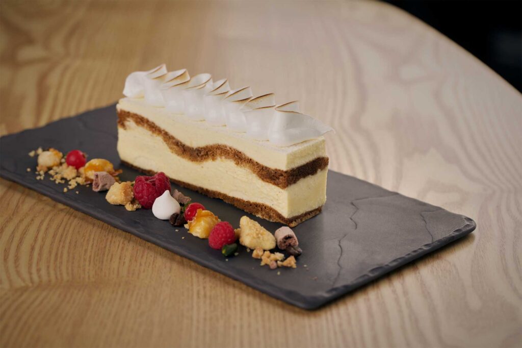 A beautifully decorated dessert cake by pastry chef Eun Jeong Lee at EJ Baking studio and cafe in Seoul, captured for the ELLE & VIRE PROFESSIONNEL PRINT MAGAZINE series.