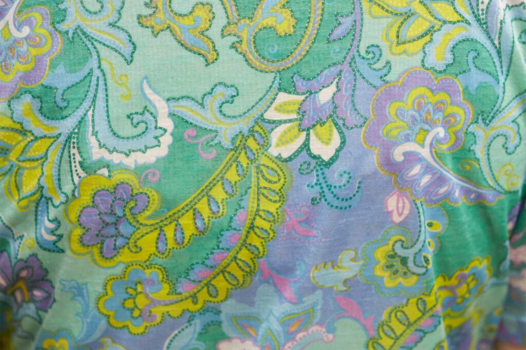 Close-up of the intricate pattern on the blouse worn by the owner of a Seoul hairdressing salon, featured in AS IT IS magazine's issue on the beauty of aging.