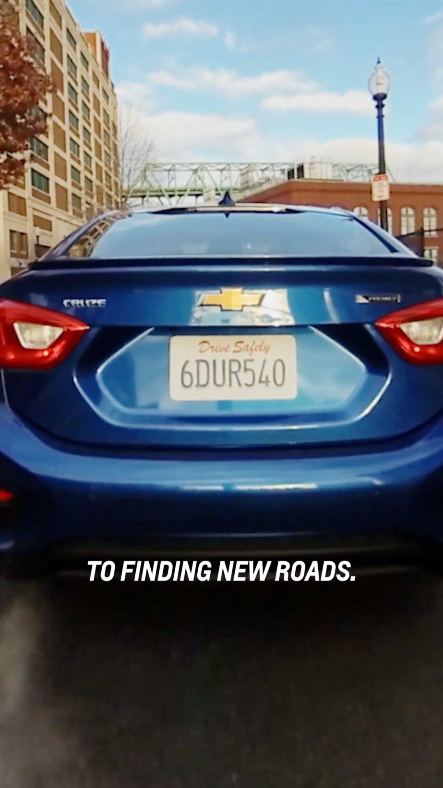 A Chevrolet seen from behind, ready to depart on new paths, as part of the Chevrolet New Year New Roads campaign.