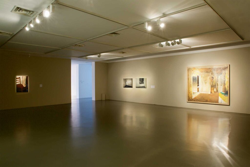 Medium-sized exhibition room at Irony & Idealism exhibition at Gyeonggi Museum of Modern Art, South Korea, featuring range of framed paintings resembling interior spaces.