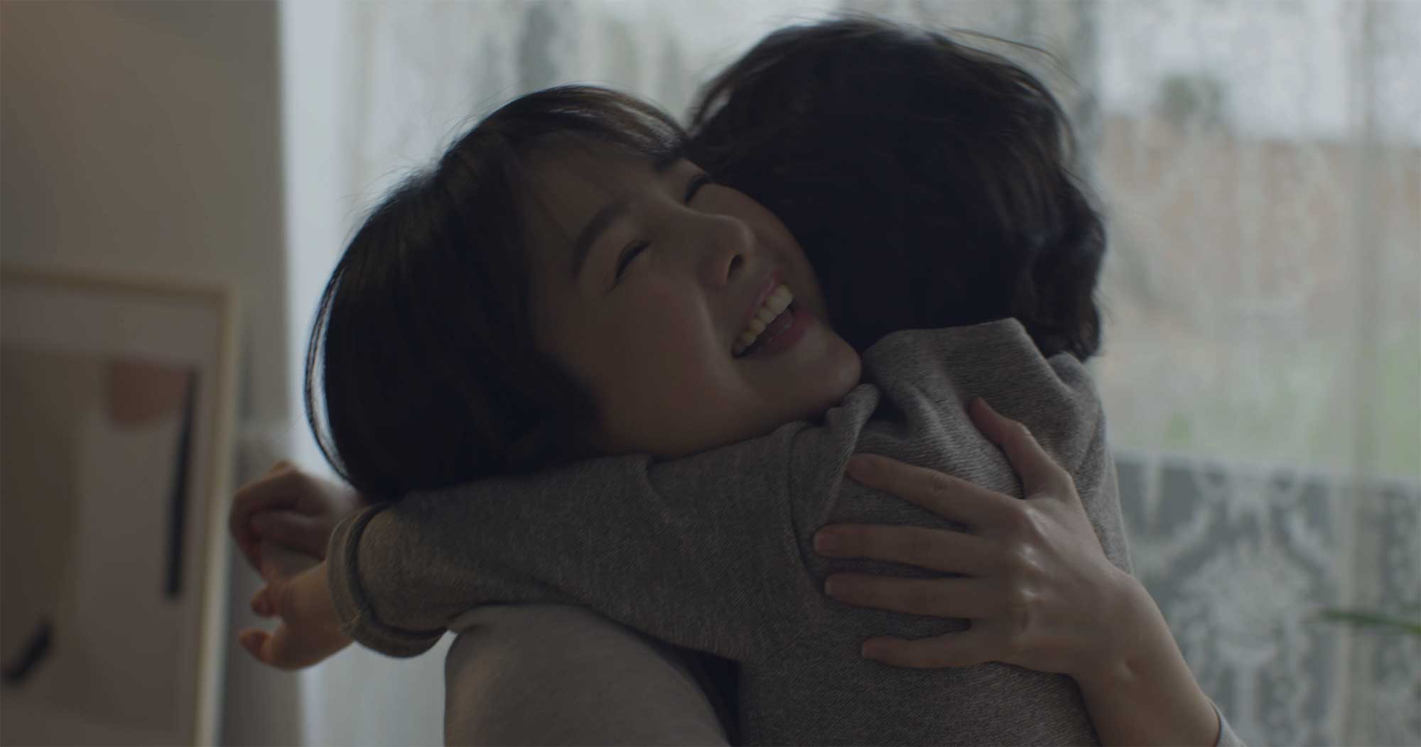 Mother hugging smiling boy in Samsung Life Insurance video