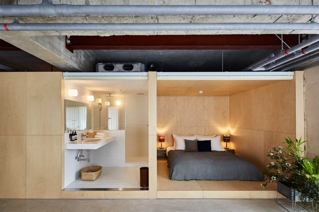 Wide shot of hotel room at D&Department Jeju by Arario, designed by Schemata Architects.