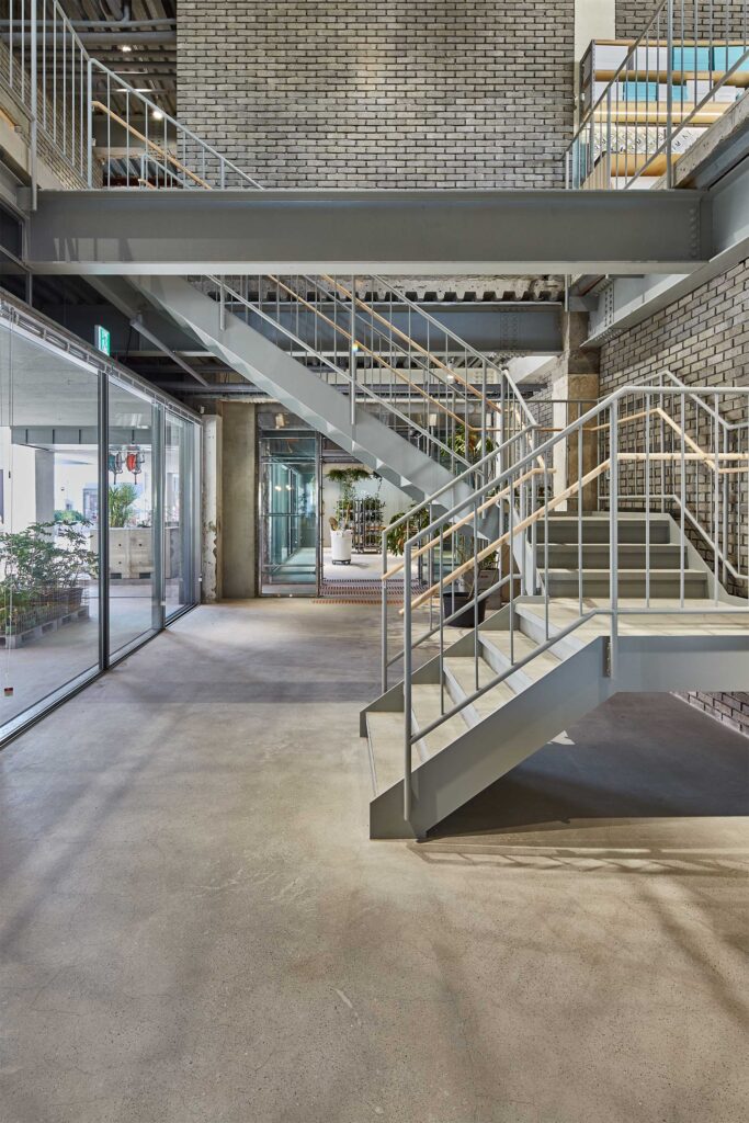 Stylish staircase connecting restaurant area and D&Department store second floor in D&Department Jeju by Arario.