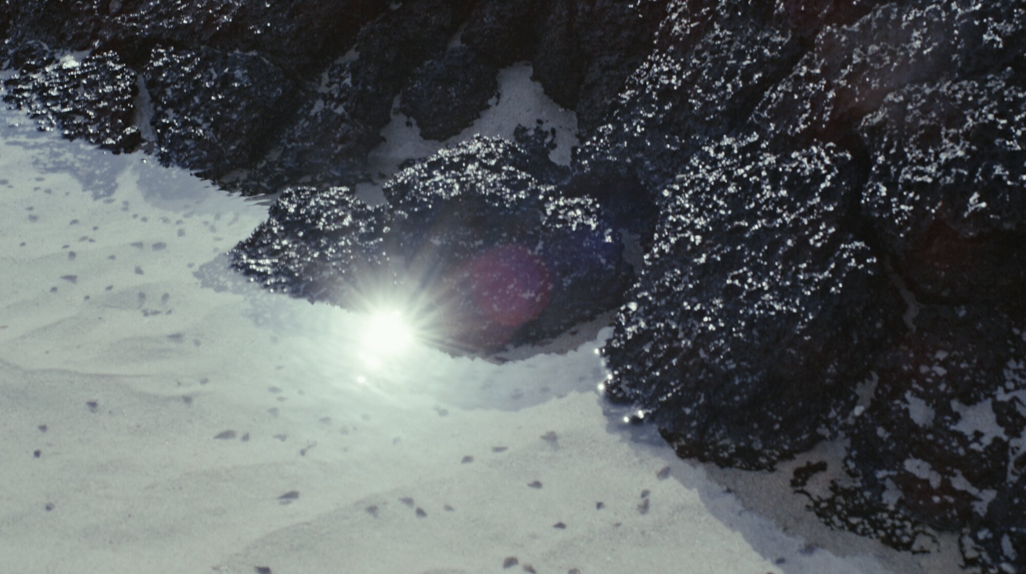 Sunlight on water and rocks for ZEISS House of Sun B-roll Jejudo