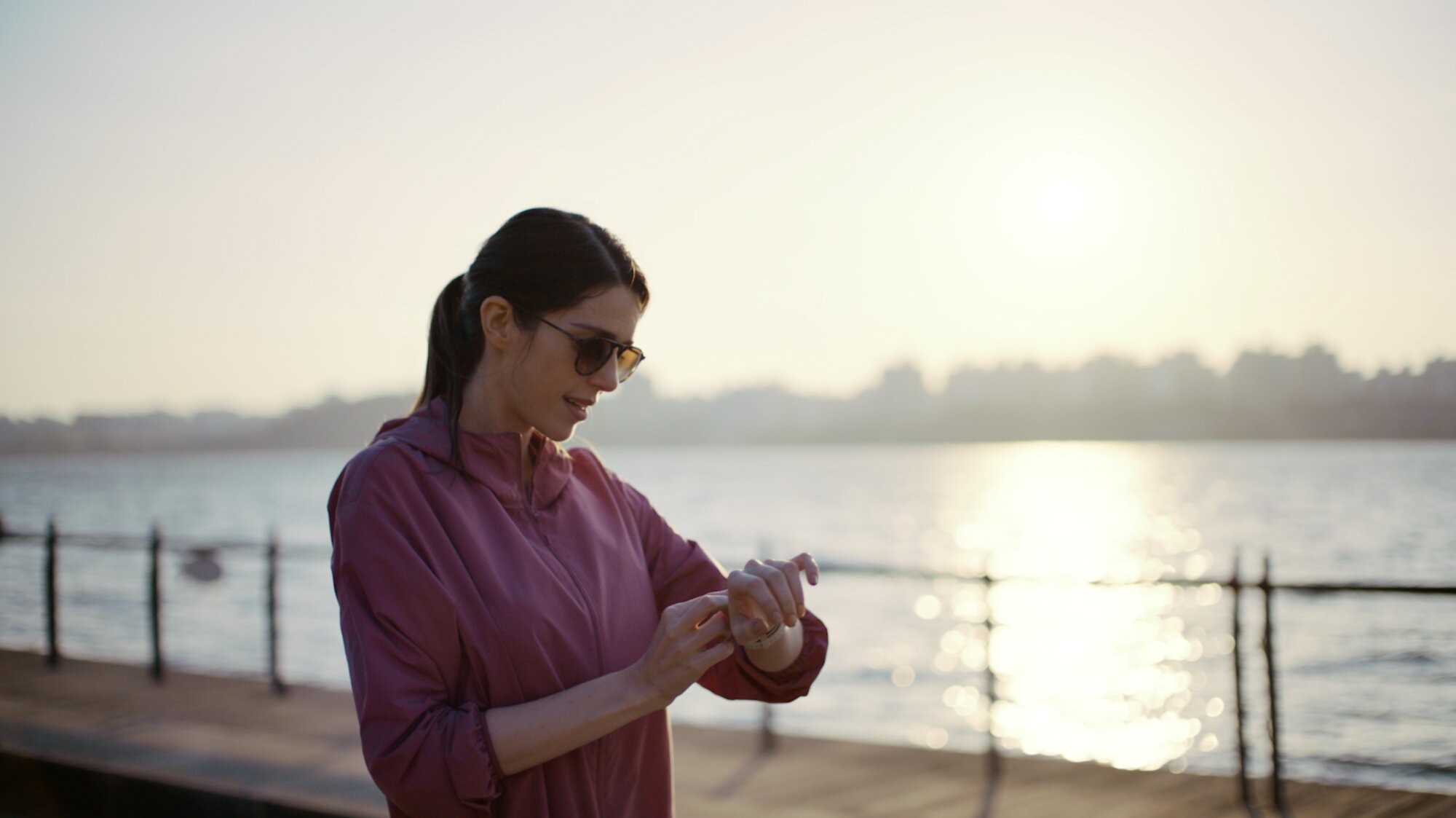 Talent adjusting sunglasses by waterfront for ZEISS House of Sun Jejudo