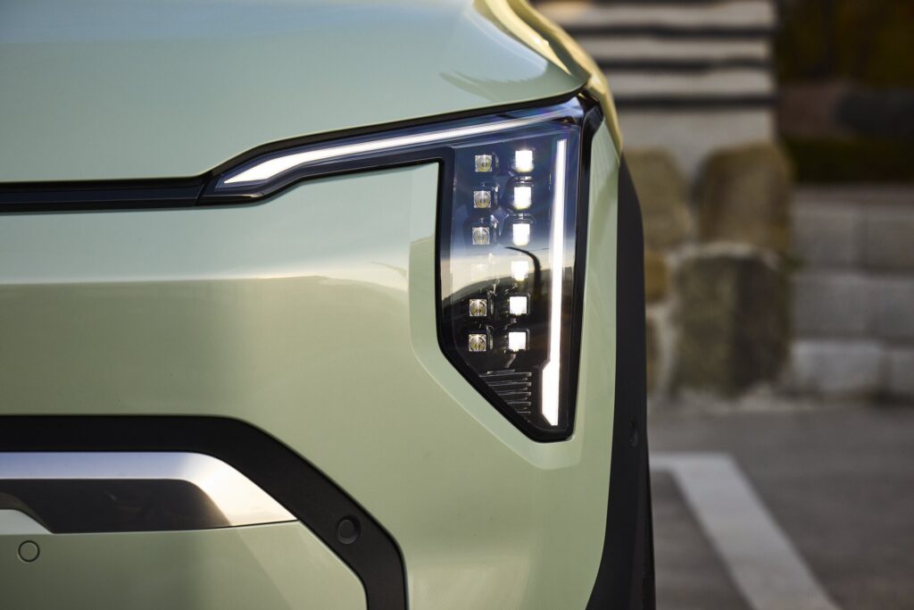 Kia EV3 front light detail in calm architectural setting at Muuun Stay.