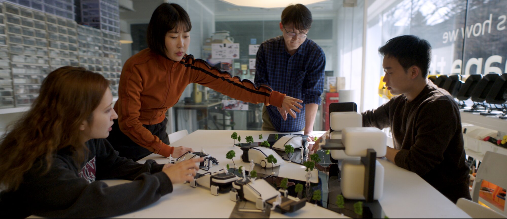 KAIST students collaborating on robotics prototype in research lab in Daejeon South Korea