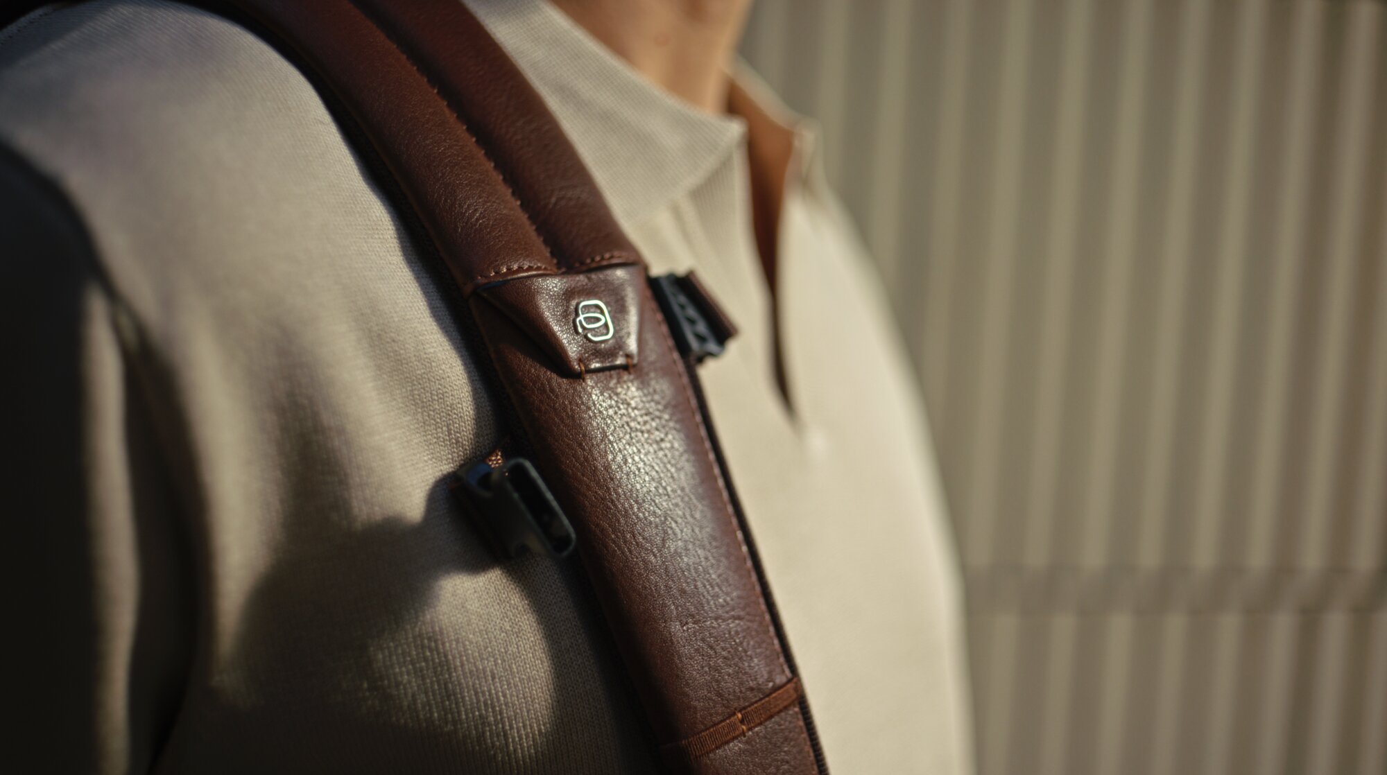 Piquadro backpack strap detail worn by Jung Sung Il in Seoul courtyard