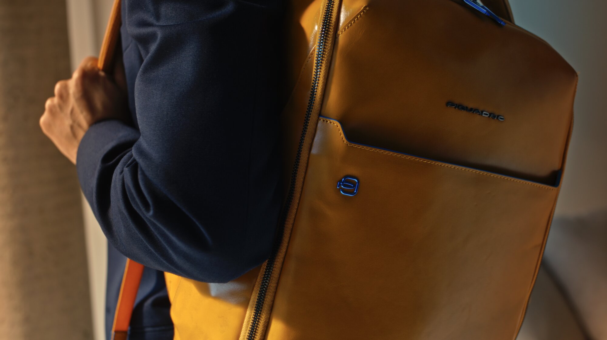 Jung Sung Il wearing Piquadro backpack leather and logo detail Seoul