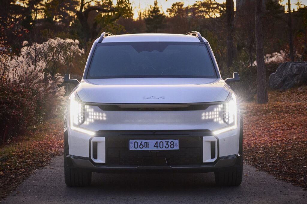 EV9 front LED signature against autumn landscape at Sayuwon.