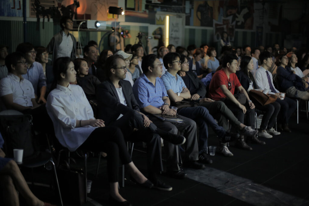 Audience seated at Art Center Nabi during 7th Encounter focused on discussion about Seoul urban space city observation and everyday life
