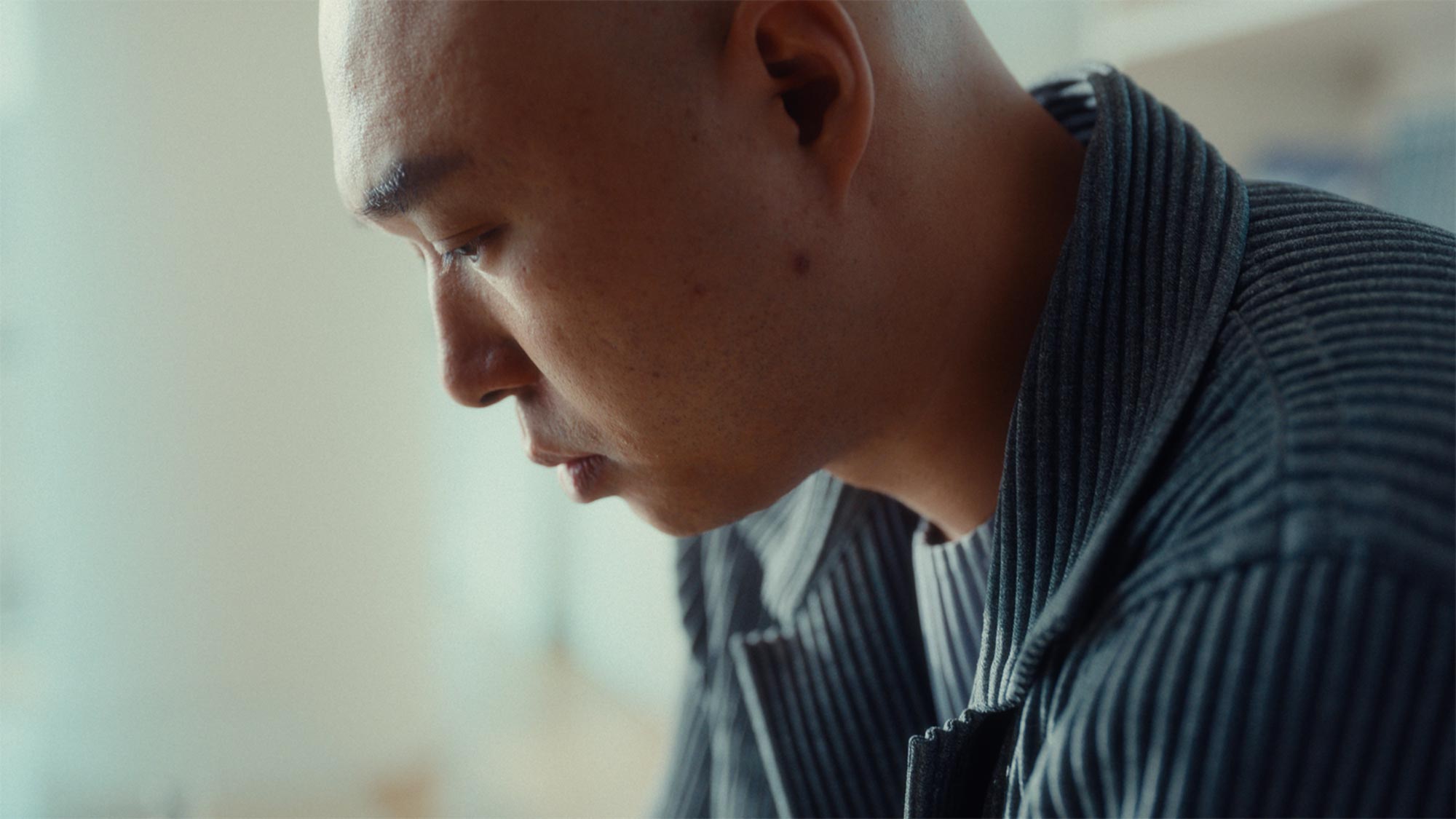 Close-up portrait of OJL Studio CEO Onejae Lee during design process