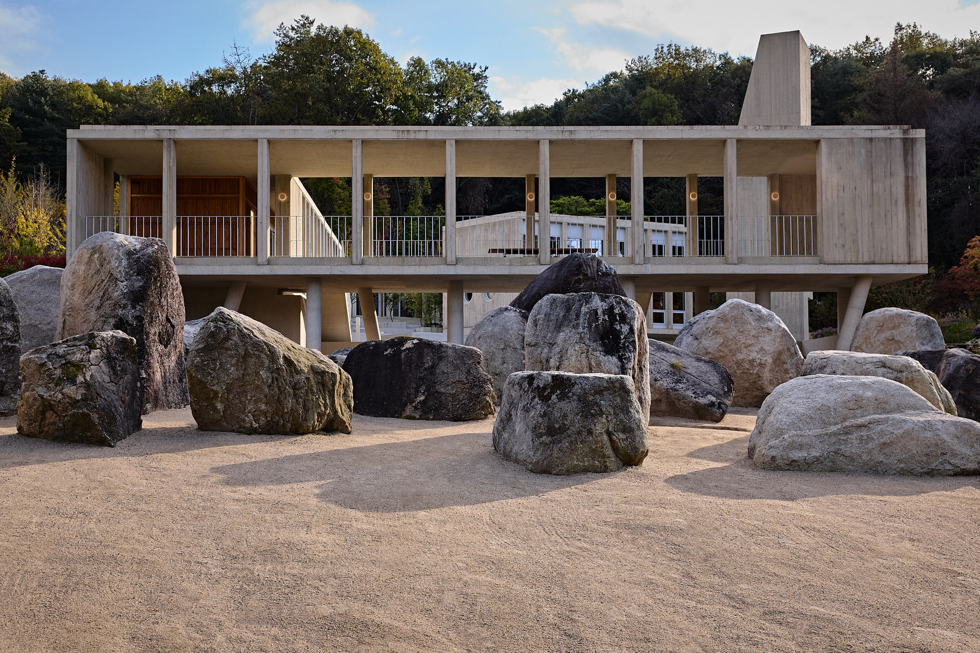 Médongaule concrete architecture framed by sculptural stone garden