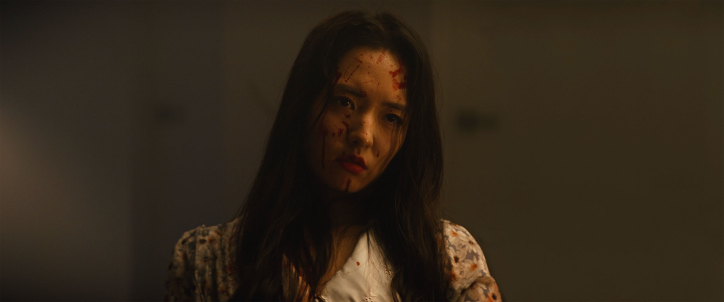 Bloodied Hojo Shin in dramatic warm light in IDOLS