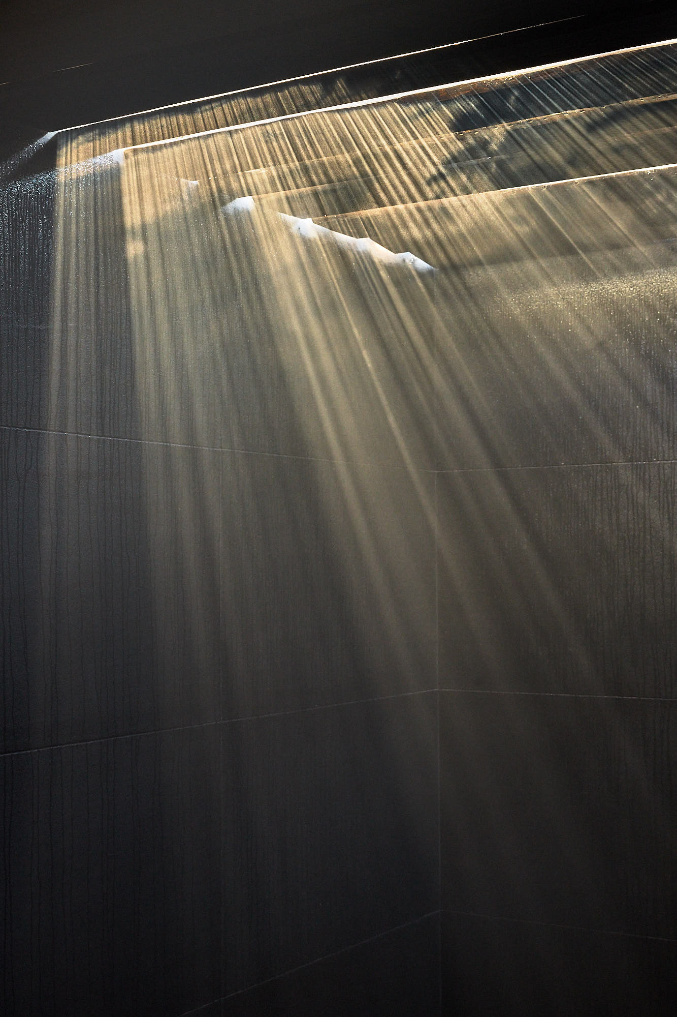 Steam rising from a hot bath in sunlight at Myök