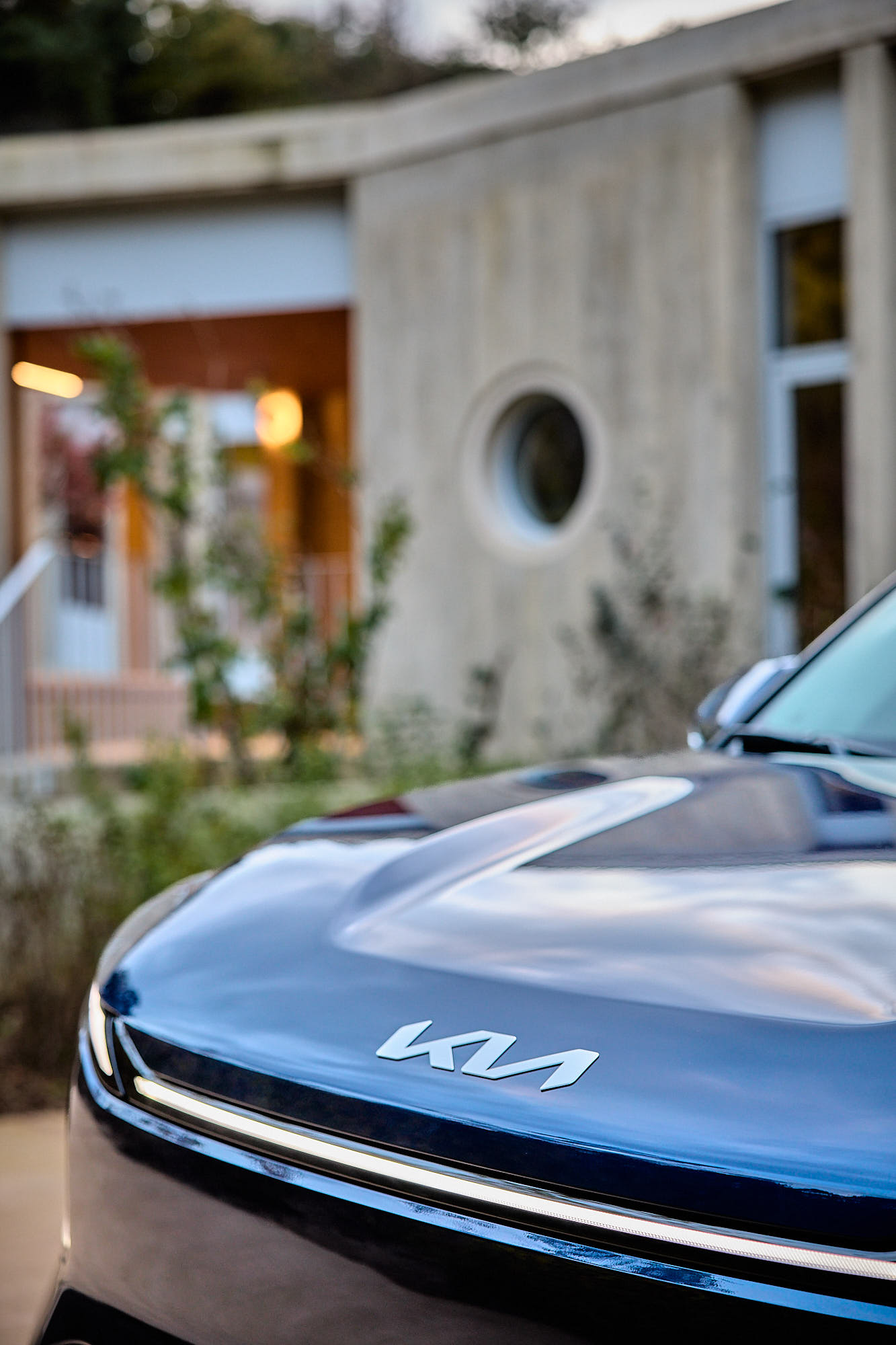 Close-up of Kia EV5 front design and logo at Médongaule