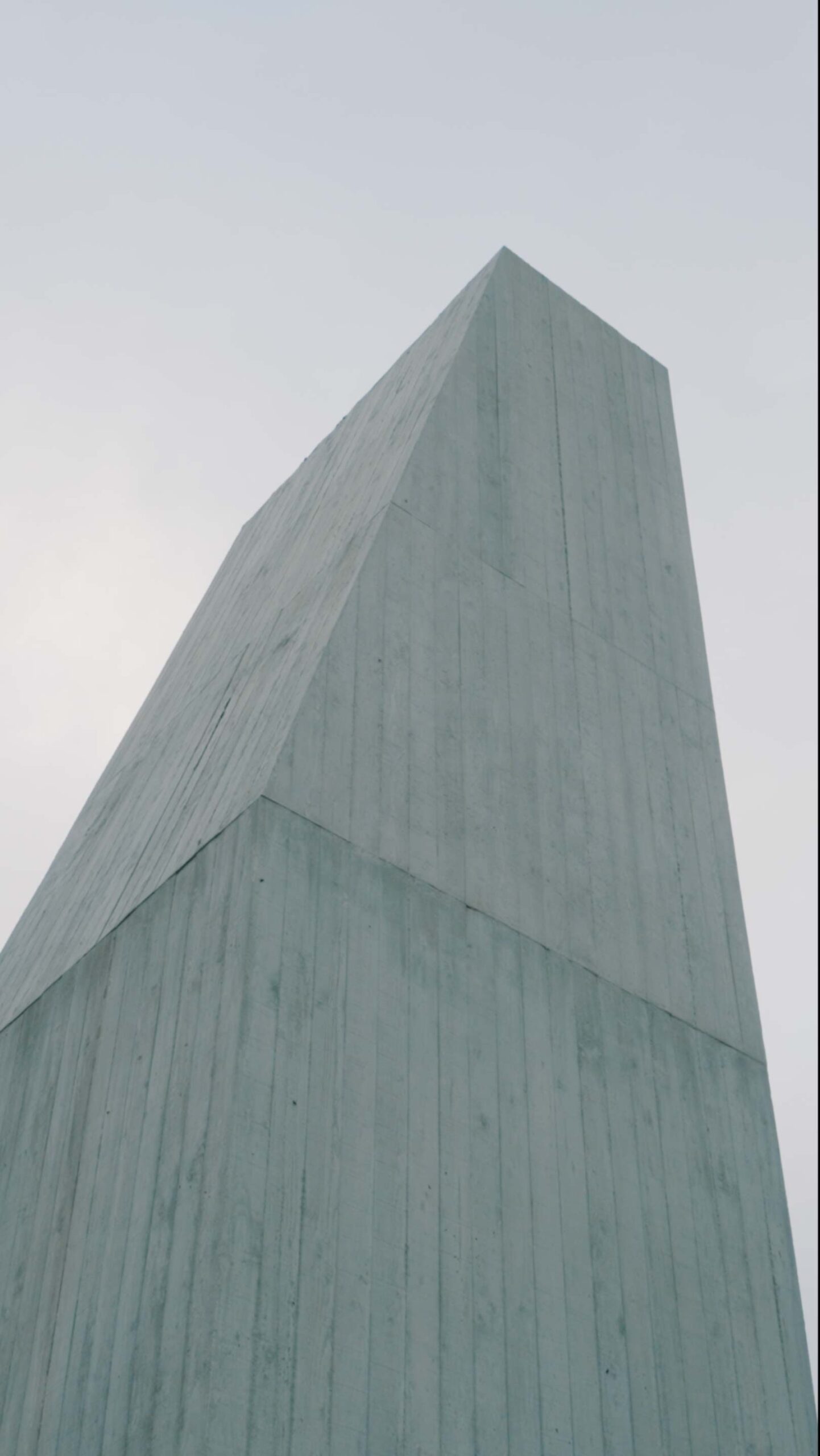 Low-angle view of sculptural concrete architecture at Médongaule