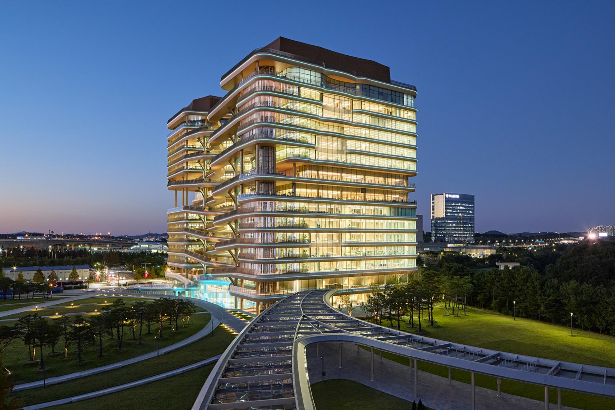 Hana Bank Headquarters by NBBJ illuminated at blue hour